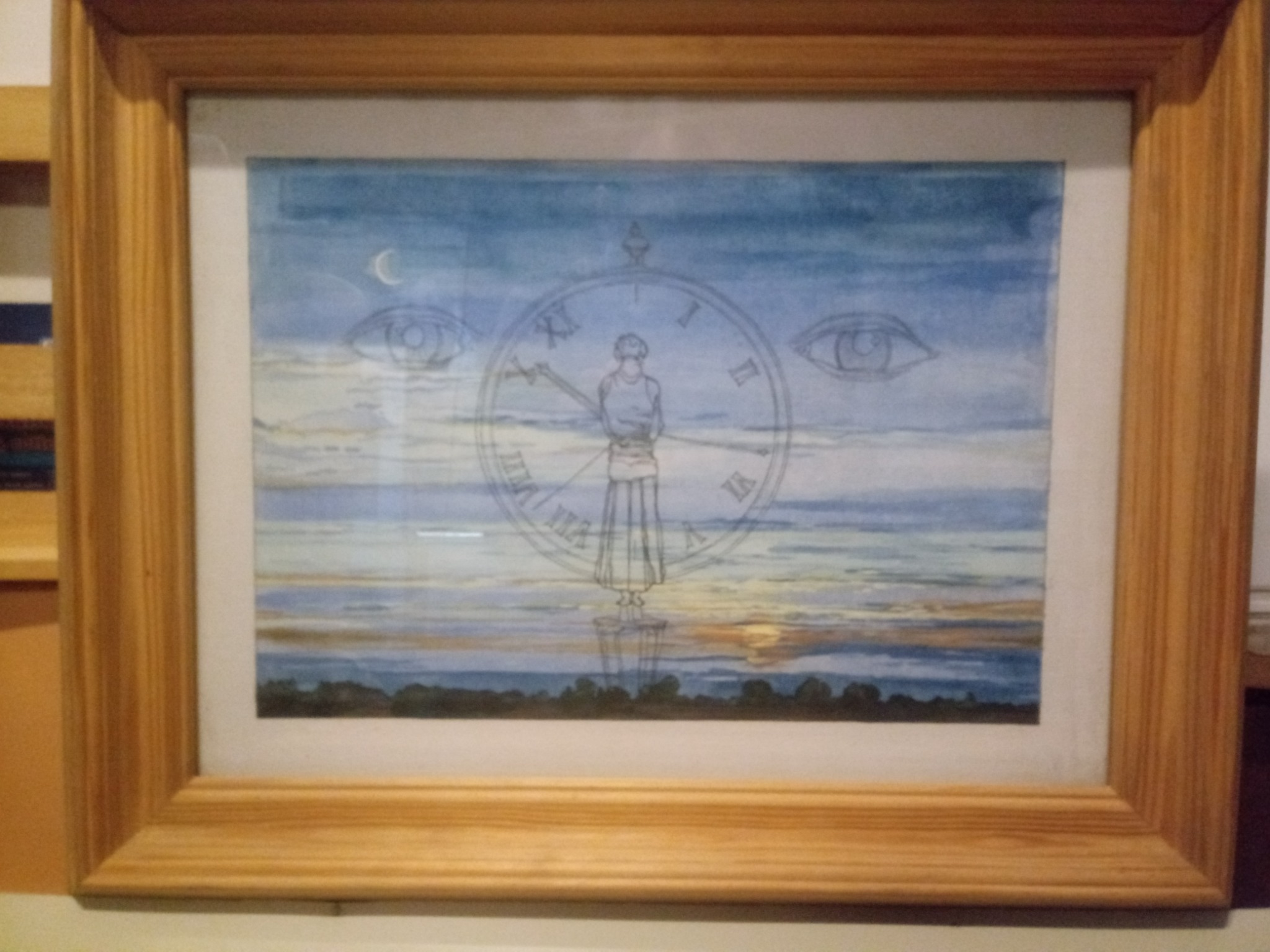Akwarela w drewnianej ramie przedstawiająca krajobraz z sylwetką osoby wkomponowaną w tarczę zegara, z motywem księżyca i oka, utrzymana w chłodnej tonacji błękitów i szarości.