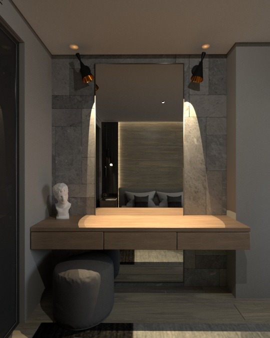 Toaletka w stylu minimalistycznym z lustrem otoczonym kamienną mozaiką i oświetleniem punktowym, z widocznym odbiciem sypialni w lustrze oraz popiersiem dekoracyjnym.