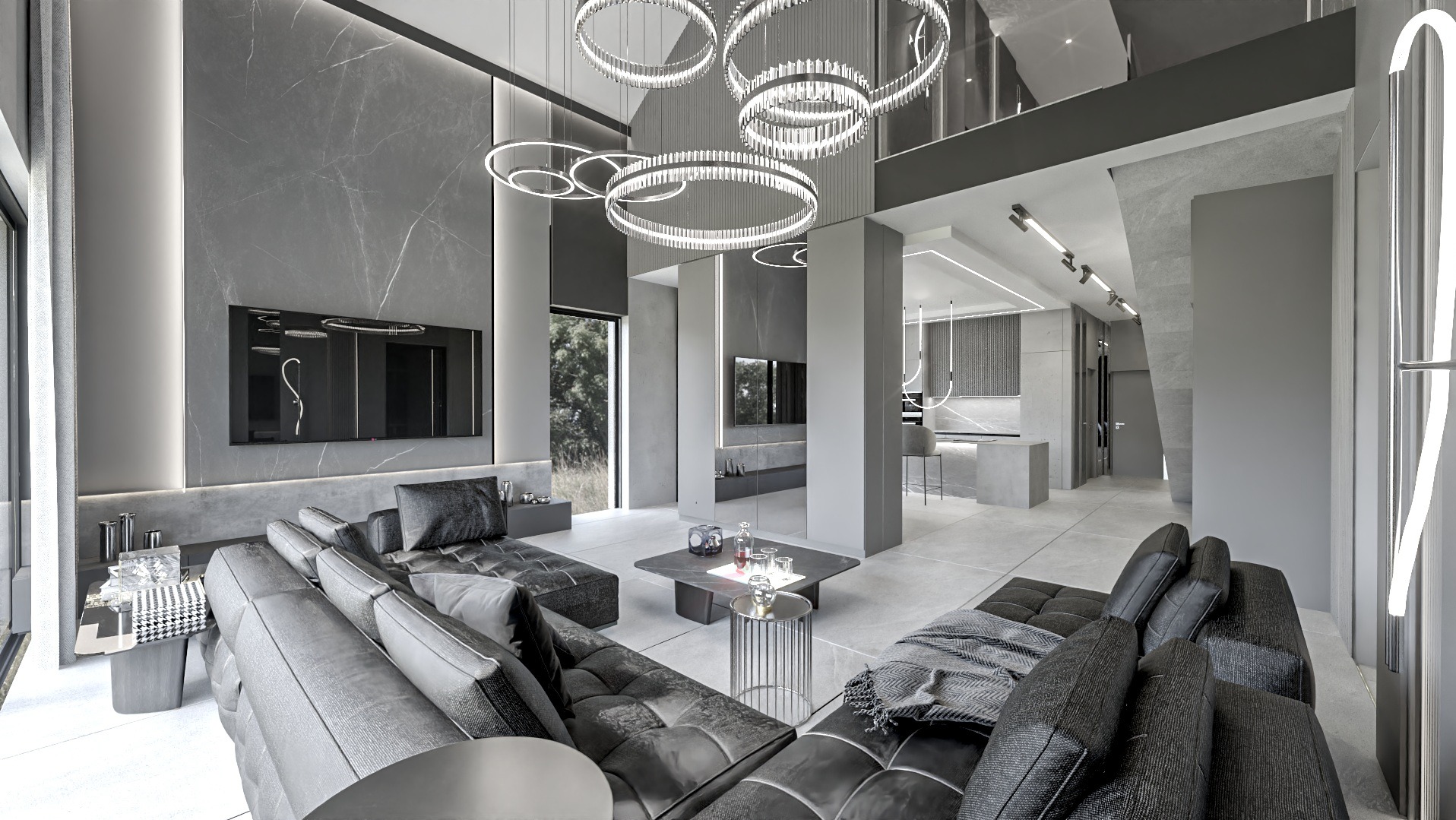 Nowoczesny salon w odcieniach szarości z marmurową ścianą, telewizorem, modułową sofą, okrągłymi lampami i widokiem na kuchnię w tle.