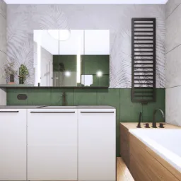 Nowoczesna łazienka z drewnianą podłogą, białymi szafkami pod umywalką, zielonymi płytkami na ścianie, lustrem z podświetleniem LED i grzejnikiem drabinkowym w kolorze czarnym.