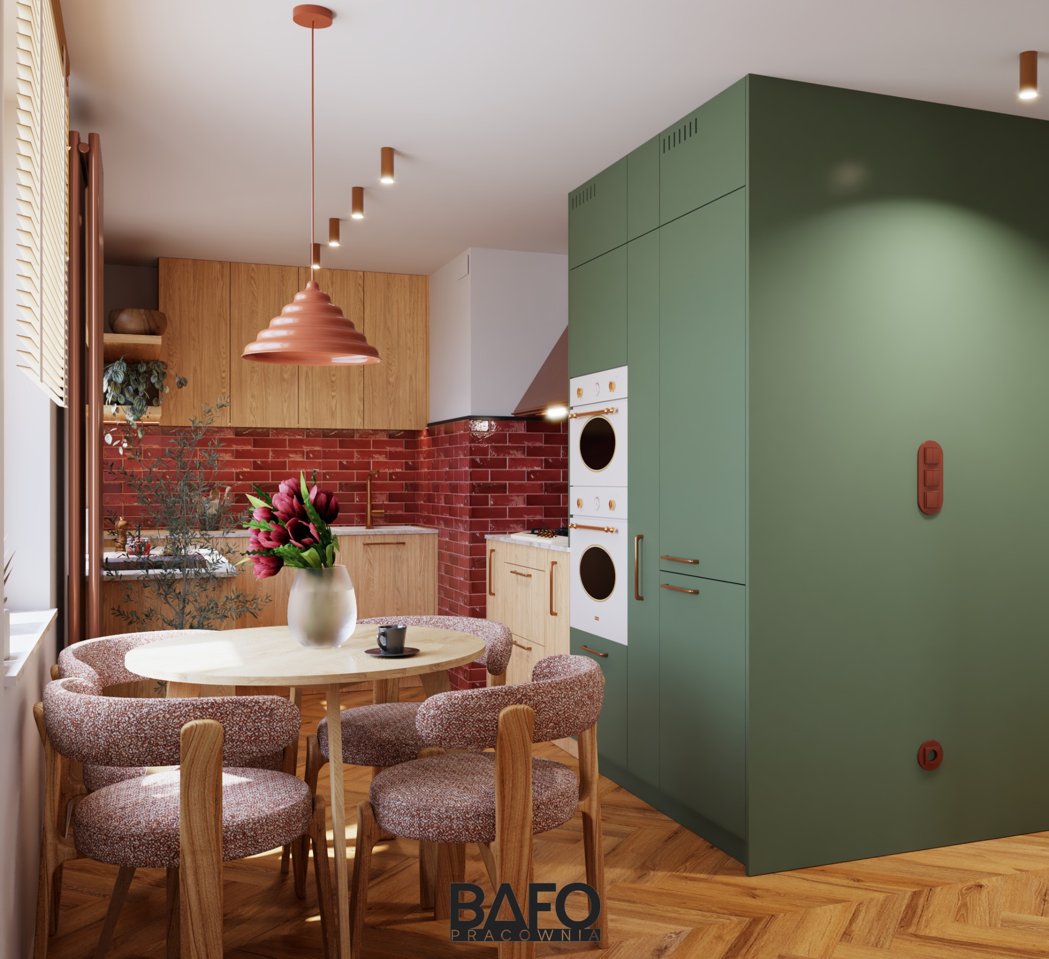 Klimatyczna kuchnia w stylu retro z ceglaną ścianą, drewnianymi szafkami i zielonymi zabudowami. Okrągły stół z kwiatami i designerska lampa wisząca.