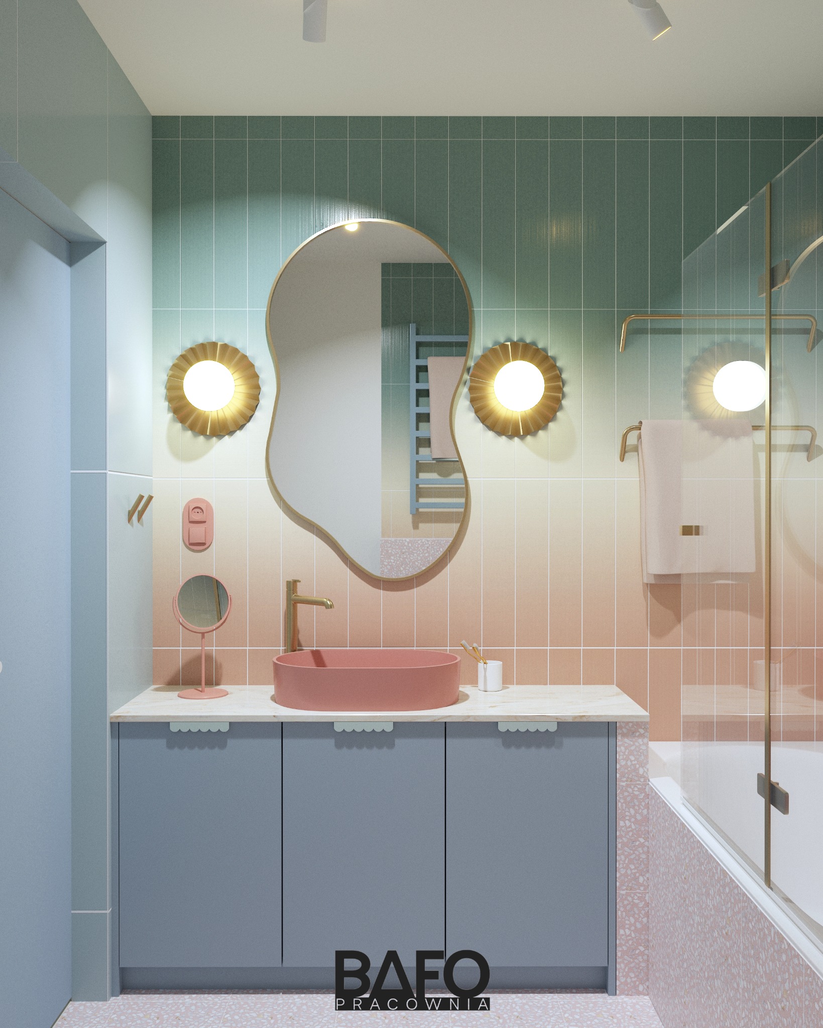 Pastelowa łazienka z umywalką w odcieniach różu, ozdobnym lustrem i złotymi akcentami. Gradientowe kafelki na ścianach dodają unikalnego charakteru.