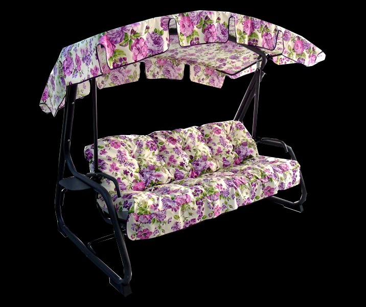 Huśtawka ogrodowa z metalową konstrukcją i kwiecistym pokrowcem oraz poduszkami, wykonana w firmie z Turka.