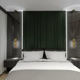 Nowoczesna sypialnia z ciemnozielonym panelem zagłówkowym, wiszącymi lampami i żaluzjami w oknie. Minimalistyczne szafki nocne i oświetlenie LED dodają elegancji.