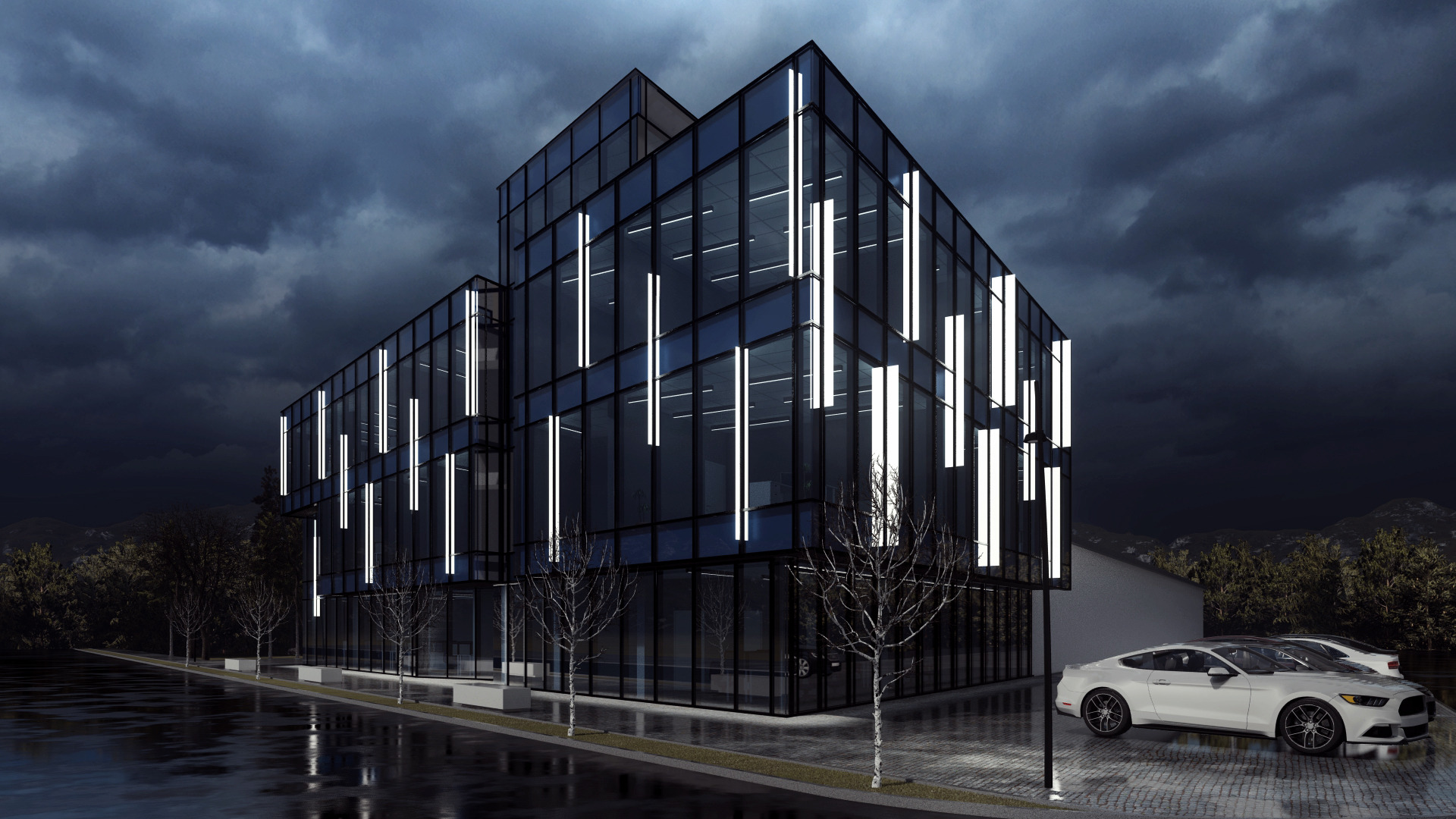 Nowoczesny biurowiec z przeszkloną fasadą i pionowymi elementami oświetleniowymi, zaparkowane białe samochody na mokrym placu, pochmurne niebo w tle.