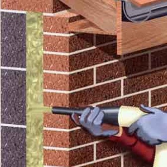 wdmuchiwanie wełny skalnej Granrock w ścianę dwu warstwową