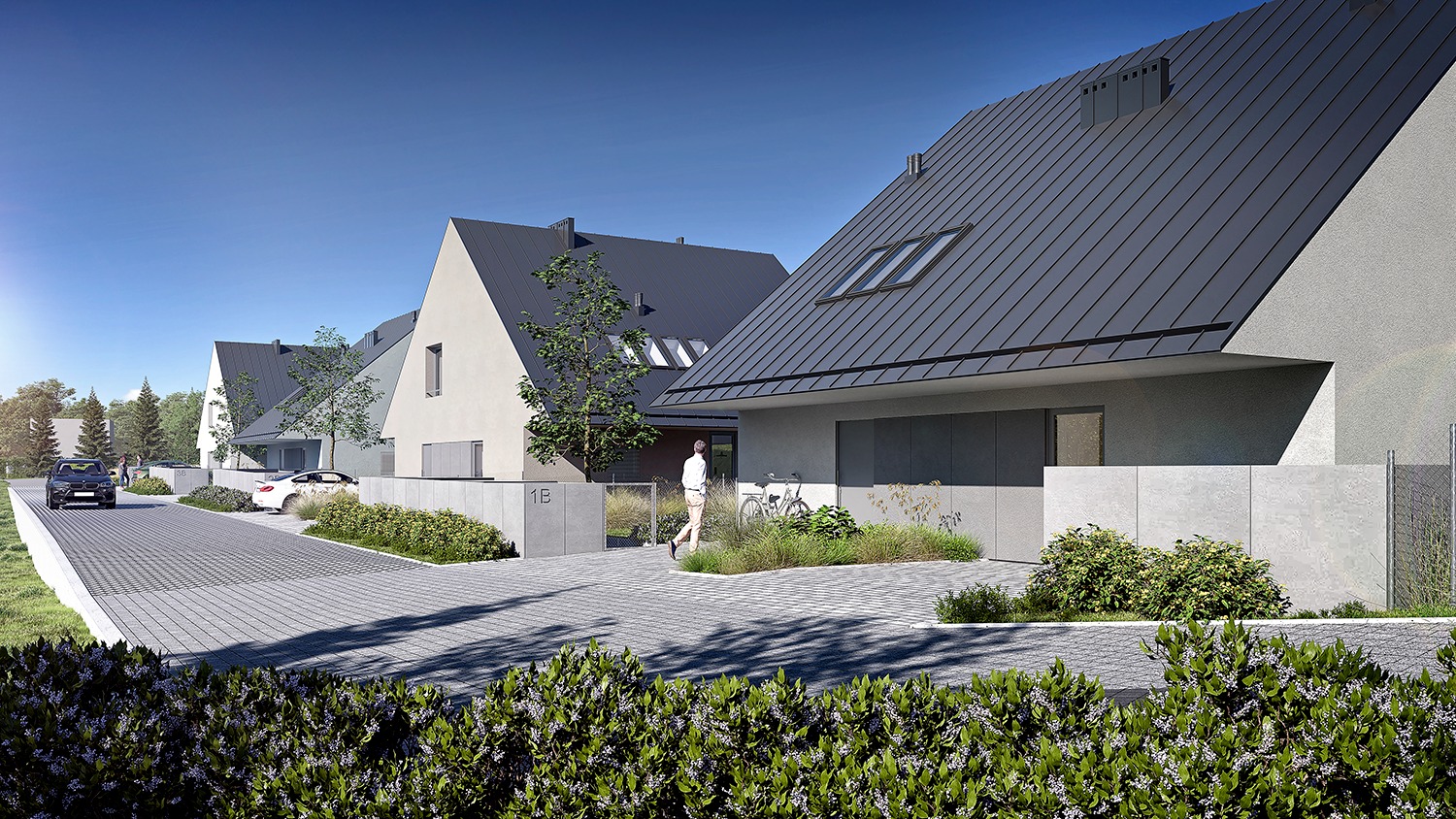 Wizualizacja szeregu nowoczesnych domów jednorodzinnych z ciemnymi dachami, jasnymi elewacjami, betonowymi ogrodzeniami i brukowaną drogą dojazdową, z osobą idącą w kierunku jednego z domów...