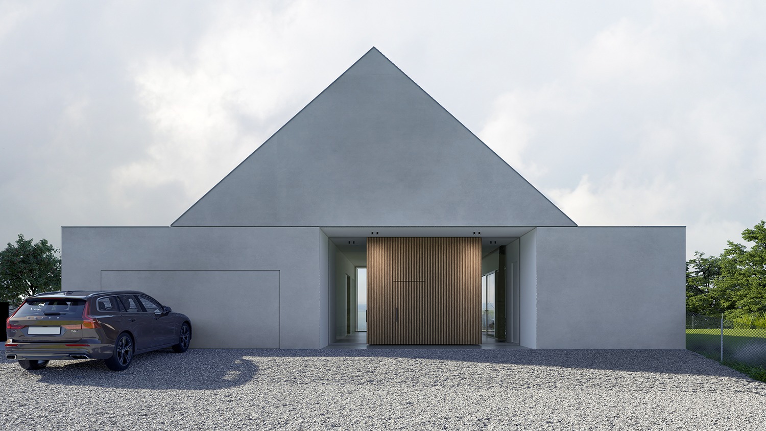 Nowoczesny dom jednorodzinny z elewacją w kolorze szarości, charakterystyczny trójkątny szczyt, drewniane drzwi wejściowe, szary samochód typu kombi zaparkowany na żwirowym podjeździe.