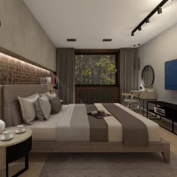 Nowoczesna sypialnia z ceglaną ścianą, drewnianymi akcentami i minimalistycznym oświetleniem. Na stoliku nocnym serwis do herbaty, a na łóżku otwarta gazeta.