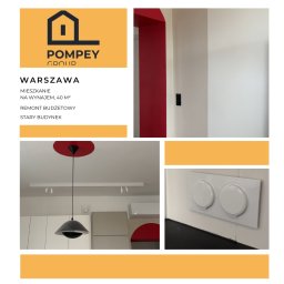 POMPEY GROUP SPÓŁKA Z OGRANICZONĄ ODPOWIEDZIALNOŚCIĄ - Wnętrze po remoncie: czerwone akcenty w odnowionym mieszkaniu w Warszawie. Nowoczesna lampa, białe ściany i detale wykończeniowe. Budżetowy remont w starym budynku.