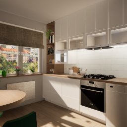 AMZ PROJEKT - Jasna kuchnia z białymi szafkami, drewnianym blatem i stołem. Na ścianie grafiki, a za oknem widok na miasto. Nowoczesny design z elementami retro, lampa w stylu vintage.