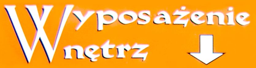 Pomarańczowy szyld z napisem 'Wyposażenie Wnętrz' i białą strzałką w dół.