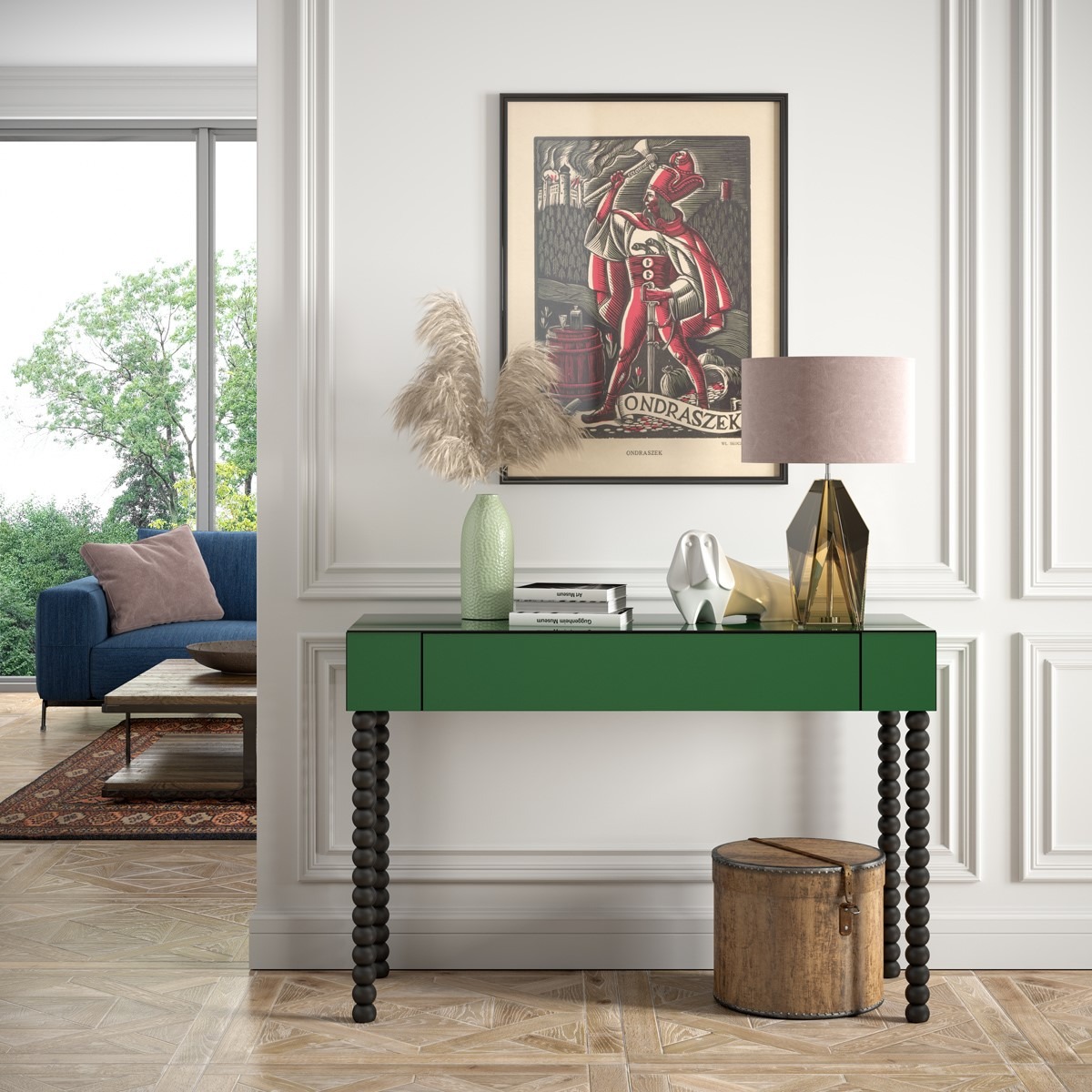 Zielona konsola z szufladą i toczonymi nogami w aranżacji wnętrza z plakatem Ondraszka i dekoracjami.
