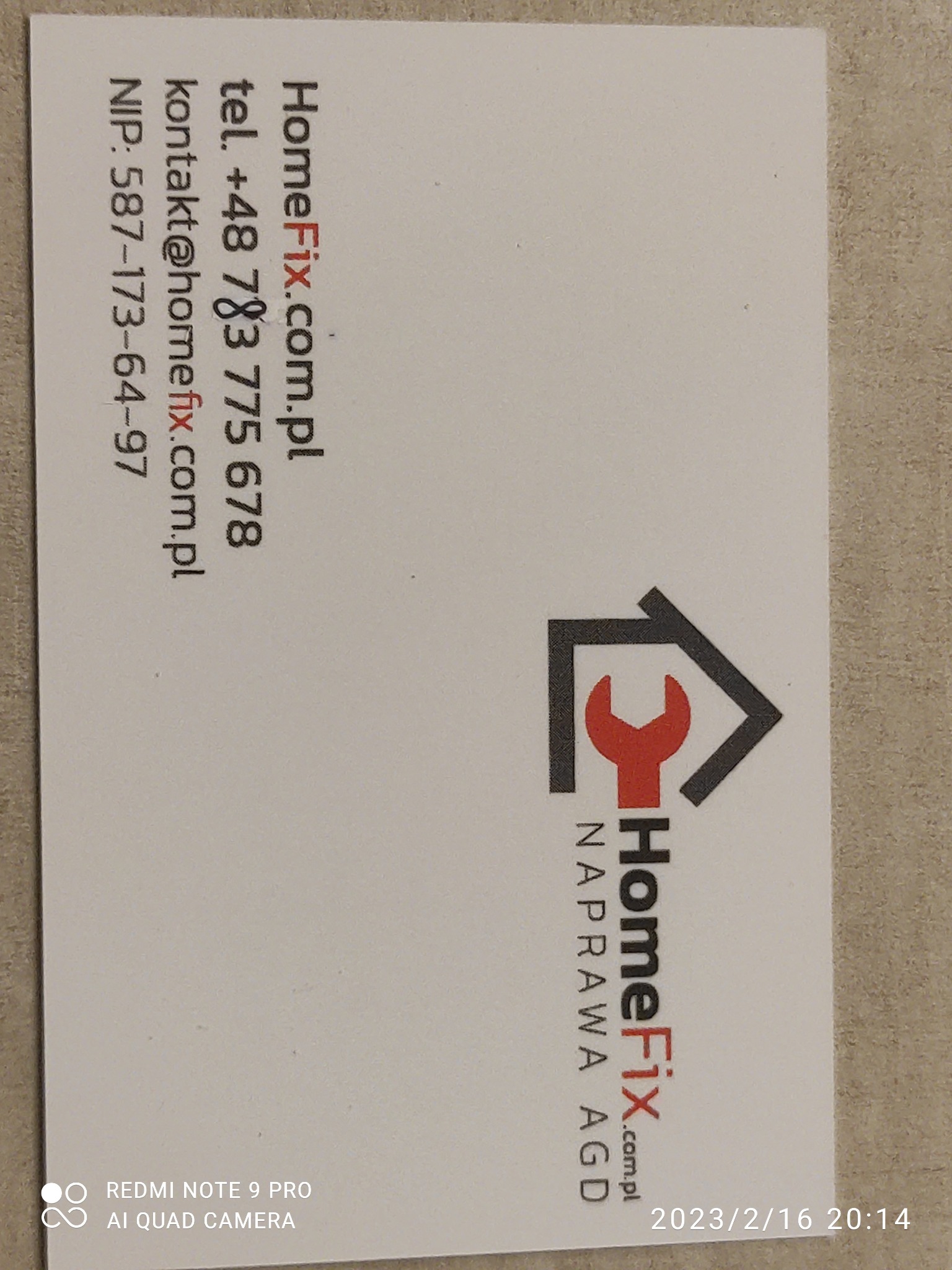Wizytówka firmy HomeFix.com.pl z numerem telefonu, adresem e-mail, NIP-em oraz logo przedstawiającym klucz w kształcie dachu domu i napisem NAPRAWA AGD.