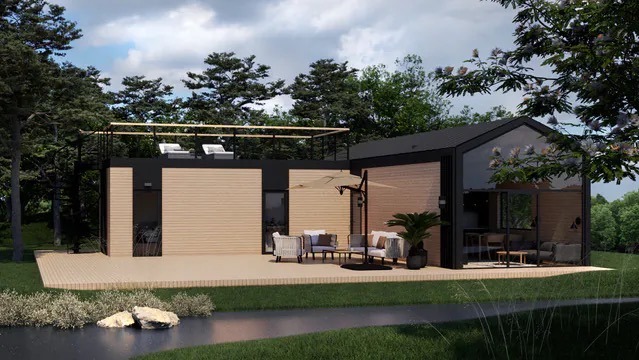 Nowoczesny dom z jasną elewacją i czarnymi akcentami, taras z meblami ogrodowymi, na dachu leżaki. Otoczenie: zieleń, drzewa, element wodny.