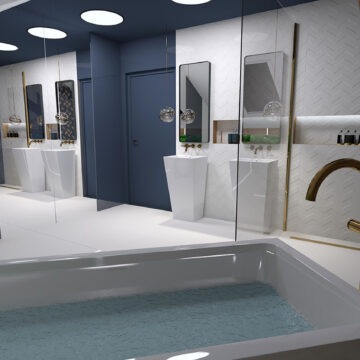 Nowoczesna łazienka z białą wanną wypełnioną wodą, białą umywalką na postumencie, lustrem w złotej ramie i granatowymi drzwiami.