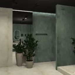 Wizualizacja nowoczesnej łazienki z zielonymi ścianami, roślinami w donicach i minimalistyczną toaletą. Widoczne oświetlenie punktowe i owalne lustro w tle.
