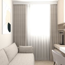 Flare Design Agata Mucha - Jasne wnętrze pokoju z sofą i biurkiem, oświetlone światłem dziennym. Minimalistyczne grafiki na ścianie, drewniane akcenty i subtelne oświetlenie LED.