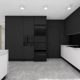 Wizualizacja nowoczesnej kuchni z przewagą czerni i bieli; zabudowa kuchenna z frontami na wysoki połysk, marmurowe blaty, szara podłoga z płytek imitujących kamień.