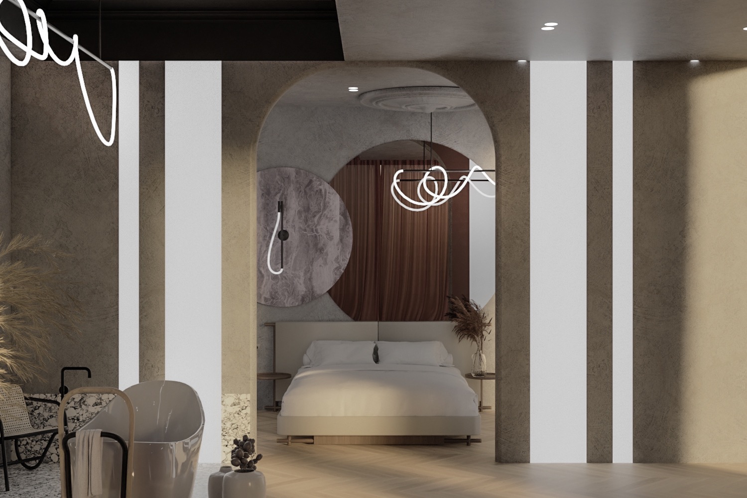 Widok na sypialnię z łazienką przez łukowate przejście; wanna wolnostojąca, rattanowe krzesło i dekoracyjne trawy na pierwszym planie, łóżko z białą pościelą w tle.