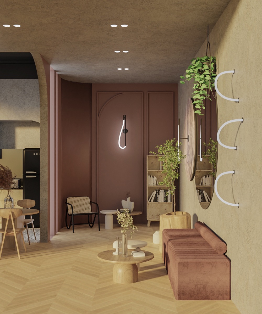 Wnętrze salonu z parkietem w jodełkę, brązową sofą z weluru, okrągłym stolikiem kawowym z drewna, regałem z książkami, lustrem w okrągłej ramie i dekoracyjną lampą na ścianie.