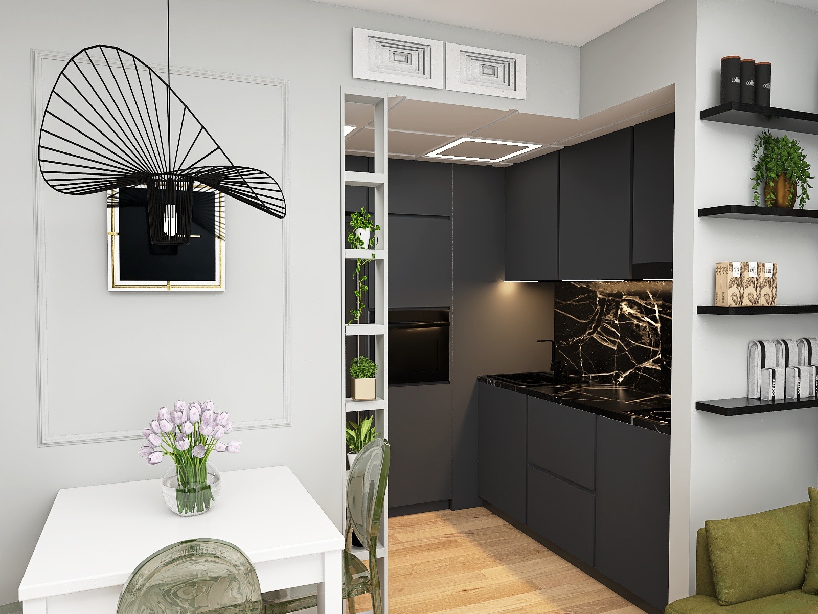 Nowoczesna kuchnia w odcieniach szarości z czarnym marmurowym blatem i minimalistyczną lampą nad białym stołem z bukietem tulipanów, widoczna półka regałowa z roślinami i ozdobnymi elementami.