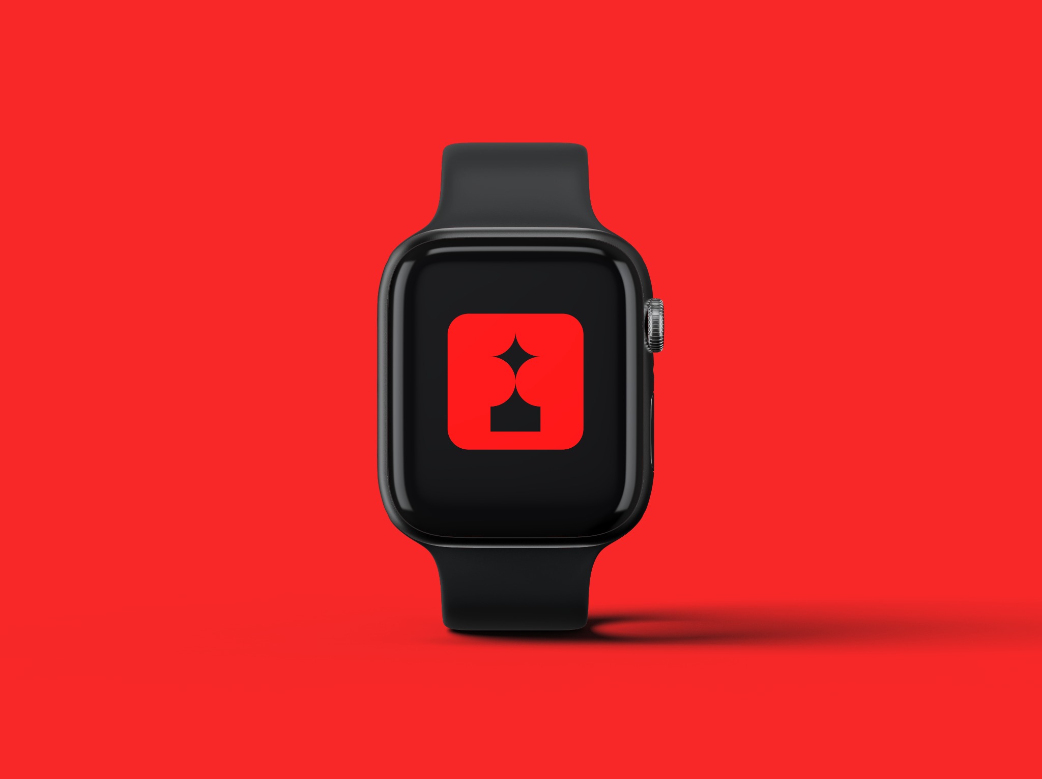 Czarny smartwatch z czerwonym kwadratem zawierającym stylizowany symbol gwiazdy i odwróconego trójkąta na ekranie, na jednolitym czerwonym tle.