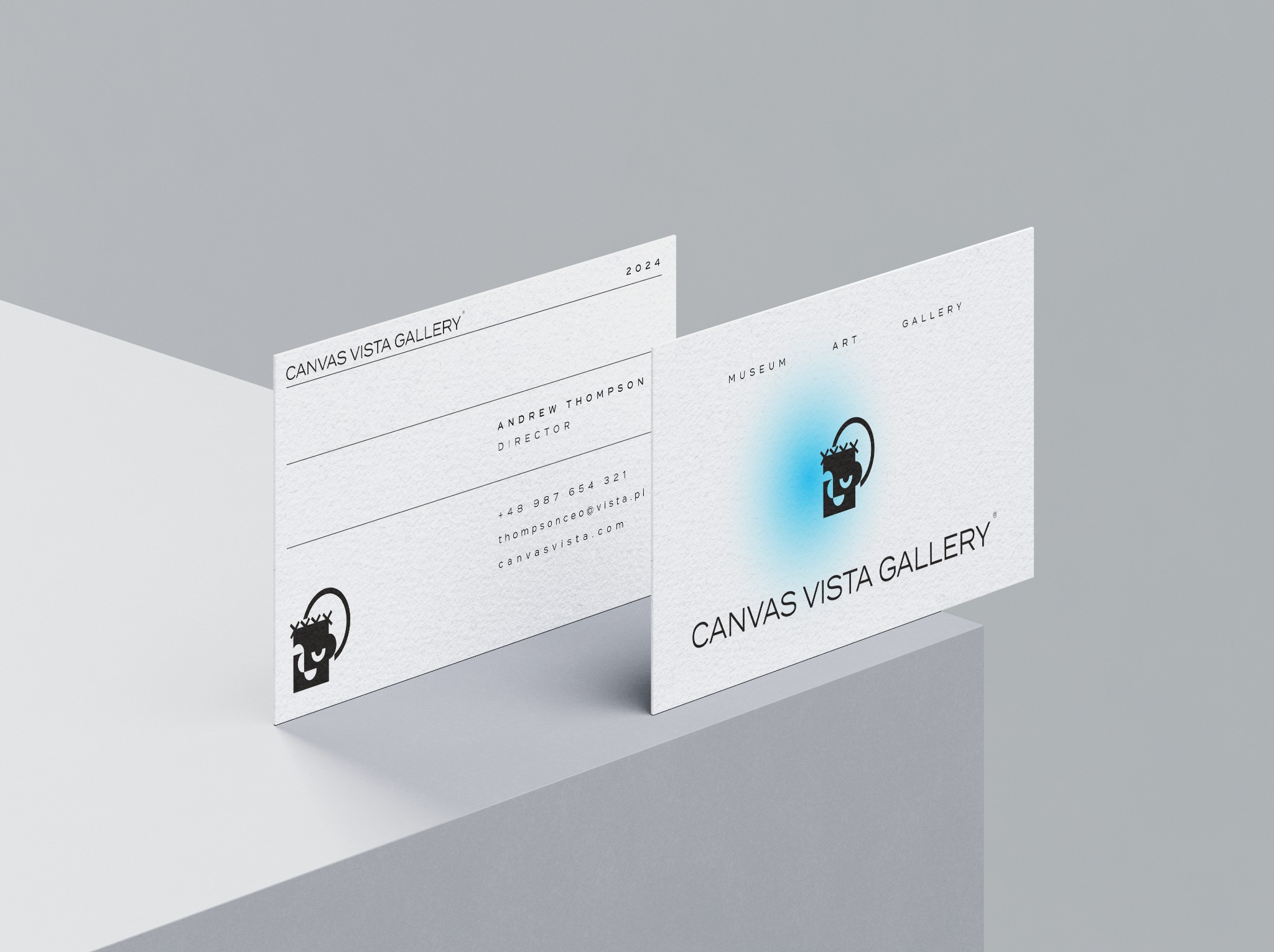 Dwie wizytówki galerii sztuki Canvas Vista Gallery, jedna z danymi kontaktowymi Andrew Thompsona, dyrektora, druga z logo i nazwą galerii na tle gradientu.