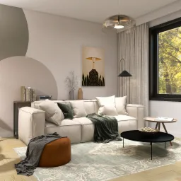 Jasny salon z kremową sofą modułową, okrągłym pufem z narzuconym szarym pledem, czarnym stolikiem kawowym z owocami, dywanem w pastelowe wzory, lampą podłogową i obrazem kobiety w kapeluszu...