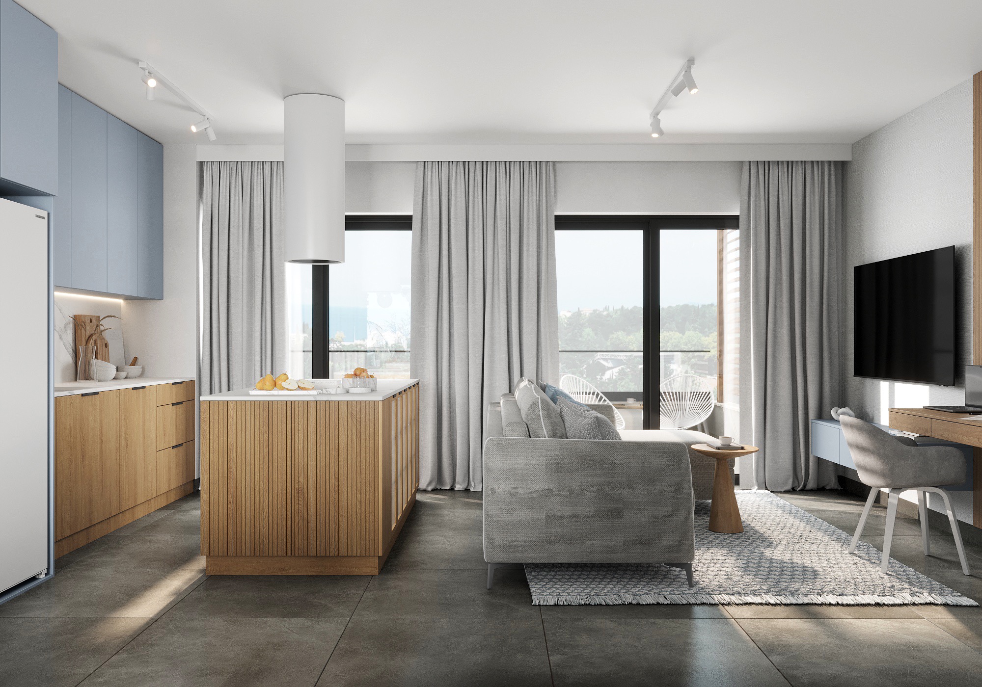 Jasne, nowoczesne wnętrze z aneksem kuchennym, wyspą z drewnianymi lamelami, szarą sofą i biurkiem w Czekanowie. Widoczne okna z widokiem na zieleń i szare zasłony.