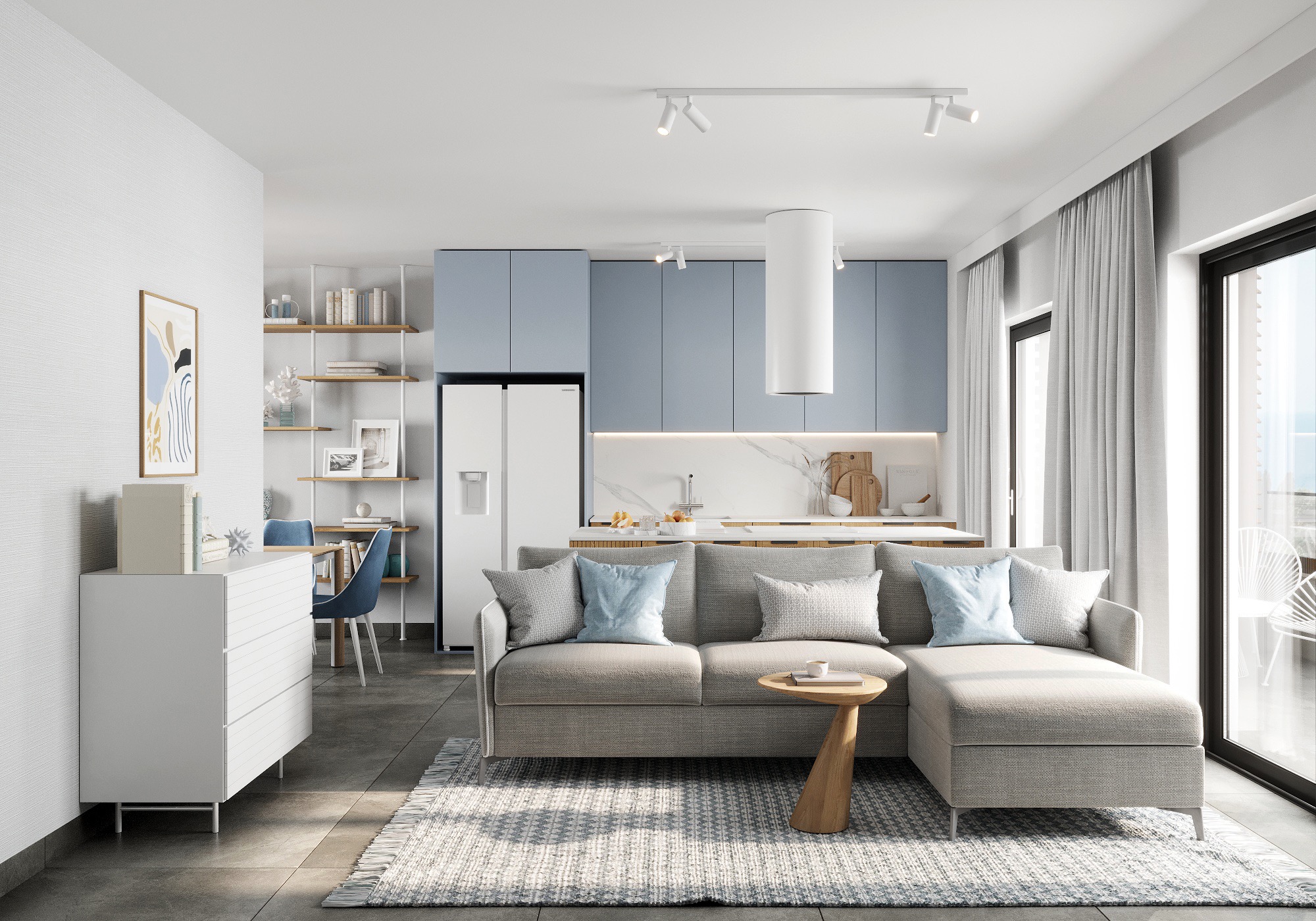 Nowoczesne wnętrze mieszkania z aneksem kuchennym, szarą sofą z błękitnymi poduszkami, drewnianym stolikiem kawowym i białą zabudową kuchenną z niebieskimi frontami.