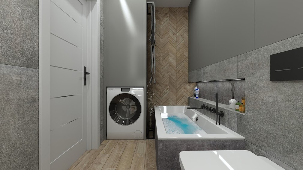 Nowoczesna łazienka z wanną wypełnioną wodą, pralką zabudowaną w szafie i drewnianą ścianą w jodełkę