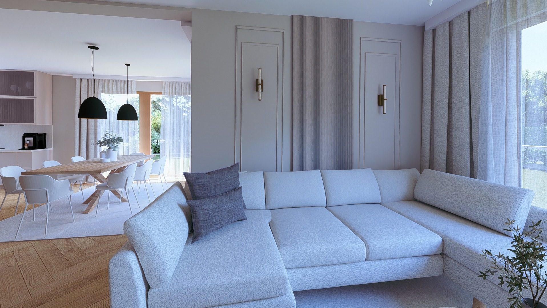 Jasny salon z narożnikiem, drewnianym stołem i krzesłami. Widoczne lampy wiszące. Neutralna kolorystyka, minimalistyczny styl, duże okno z widokiem na zieleń.