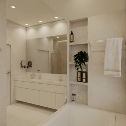 Zielona Posesja - Minimalistyczna łazienka w beżach: wanna, umywalka z szafką, lustro z oświetleniem, półki z kosmetykami i rośliną. Stonowana kolorystyka, nowoczesny design.