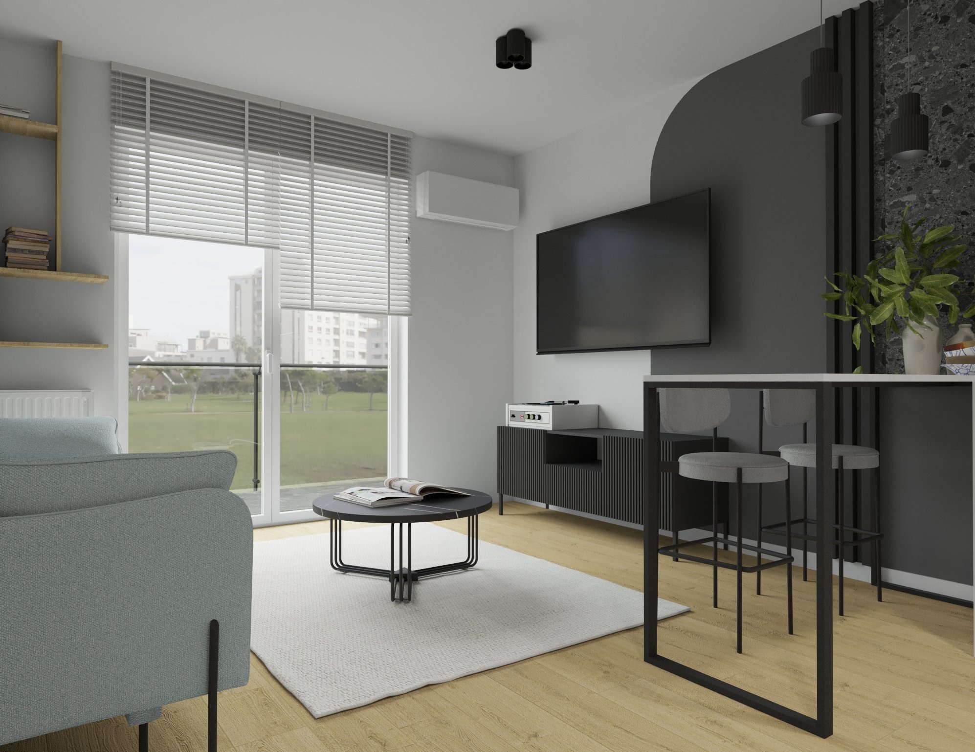 Nowoczesny salon z szarą sofą, okrągłym stolikiem kawowym z marmurowym blatem, czarną szafką RTV i wysokim stołem barowym z szarymi stołkami, pod oknem widok na osiedle.