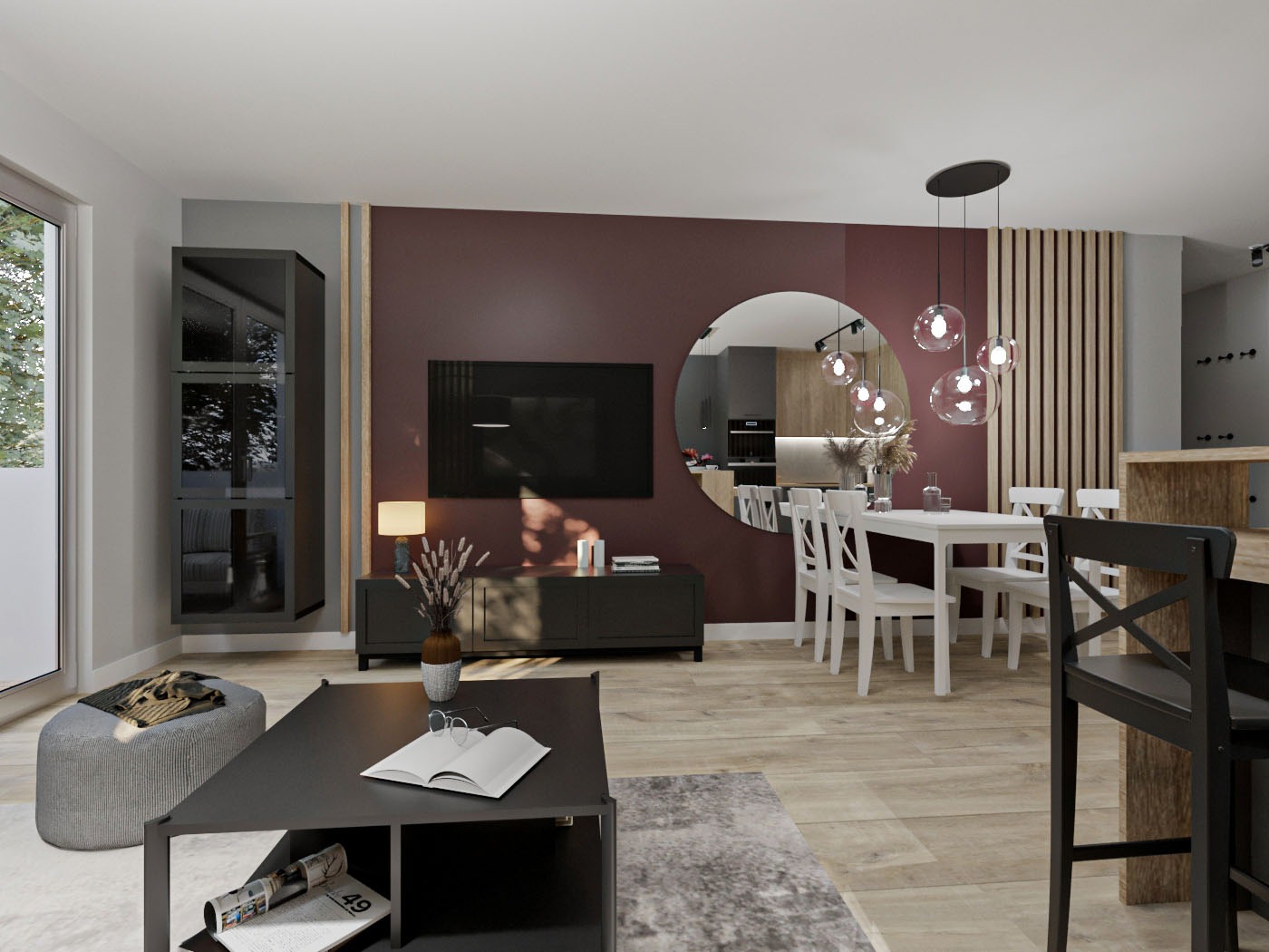 Nowoczesne wnętrze salonu z jadalnią, burgundowa ściana z telewizorem, okrągłe lustro odbijające kuchnię, biały stół z krzesłami, szara sofa, czarny stolik kawowy z książką i okularami, drewniana...