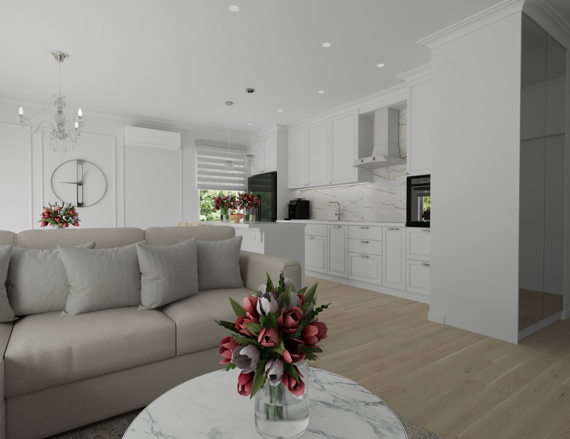 Jasne, przestronne wnętrze z aneksem kuchennym, białymi meblami, marmurowym blatem i drewnianą podłogą, widok z perspektywy salonu z beżową sofą i kwiatami na marmurowym stoliku kawowym.