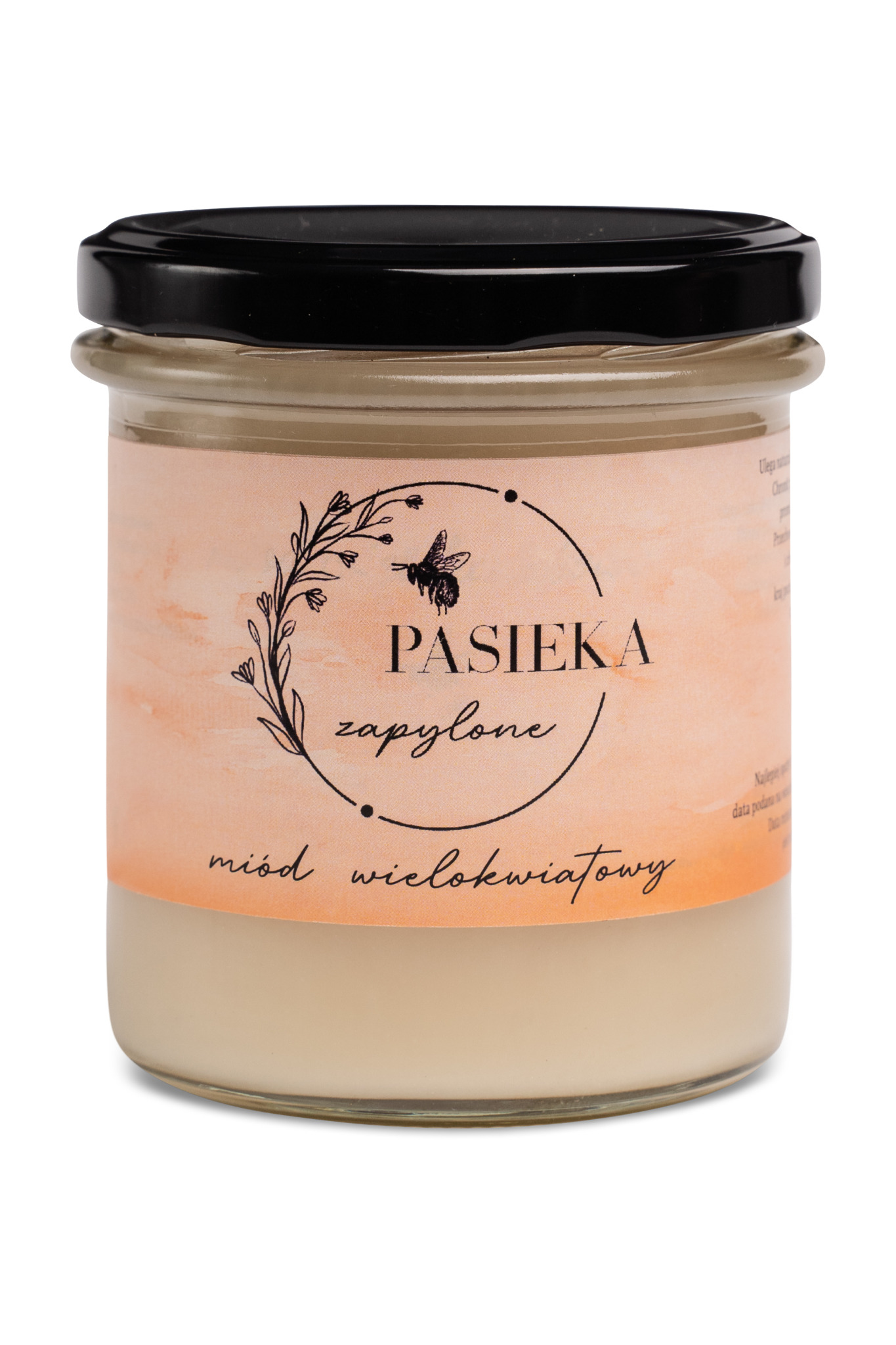 Słoik z miodem wielokwiatowym z etykietą 'Pasieka zapylone' i ilustracją pszczoły, zamknięty czarnym wieczkiem, na białym tle.