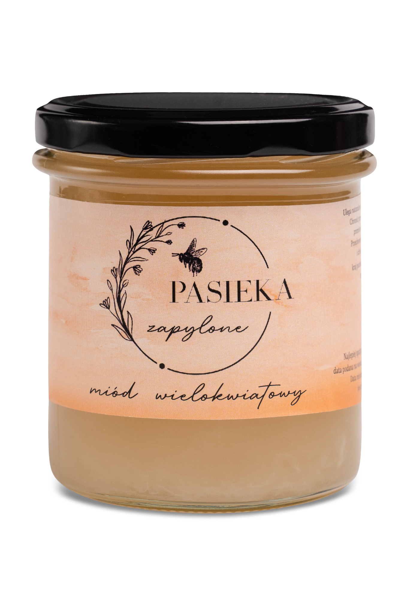 Słoik z miodem wielokwiatowym z napisem 'Pasieka zapylone', zamknięty czarnym wieczkiem, na białym tle.