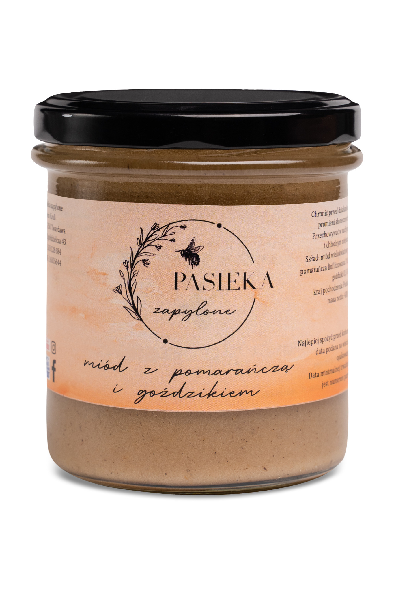 Słoik z miodem o smaku pomarańczy i goździków, etykieta z motywem pszczoły i napisem 'Pasieka Zapylone', czarna zakrętka, widoczne informacje o składzie i dacie ważności.