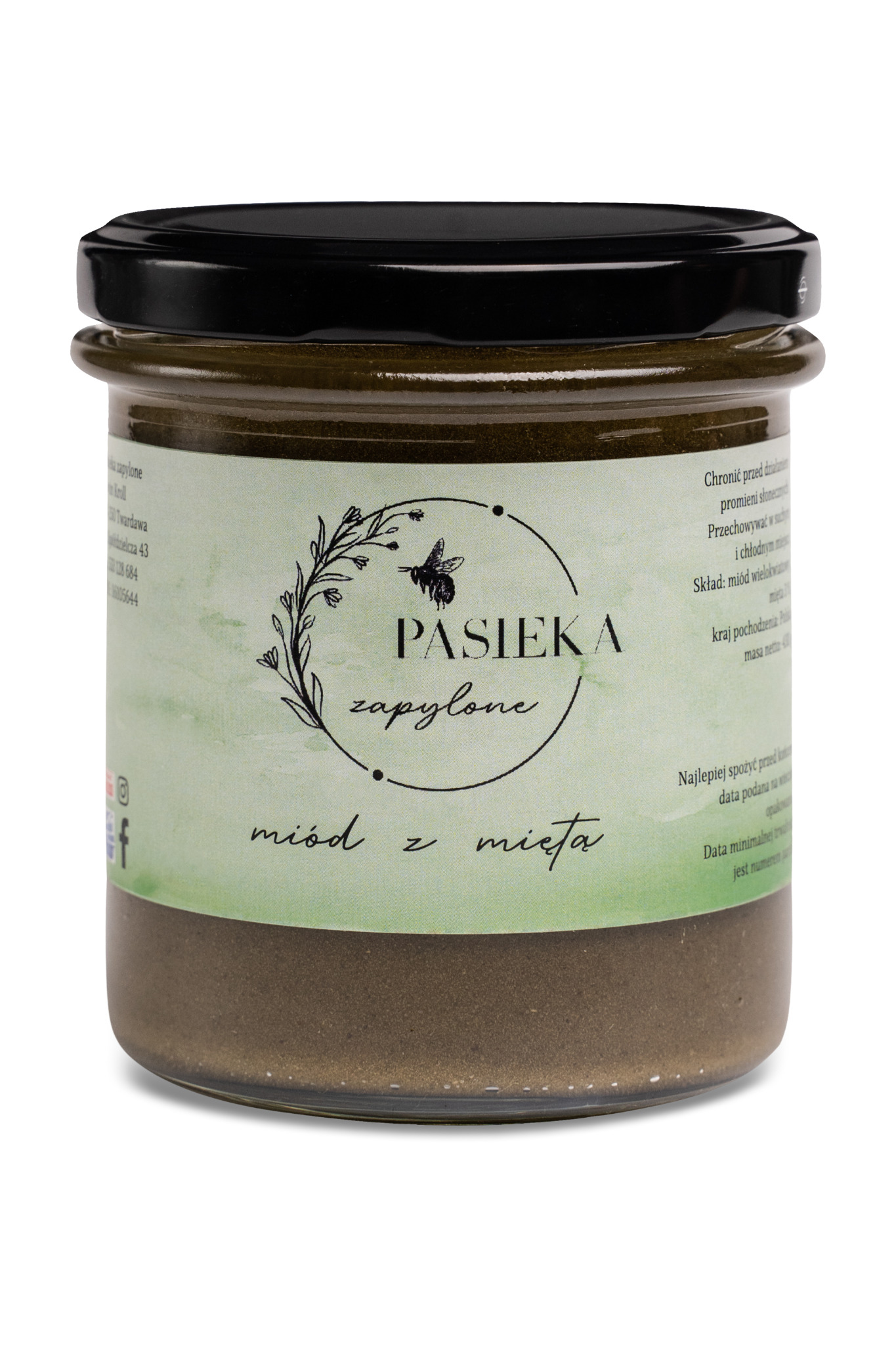 Słoik z ciemnym miodem z miętą, etykieta z motywem pszczoły i napisem Pasieka Zapylone, czarne wieczko, widoczne drobinki w miodzie.