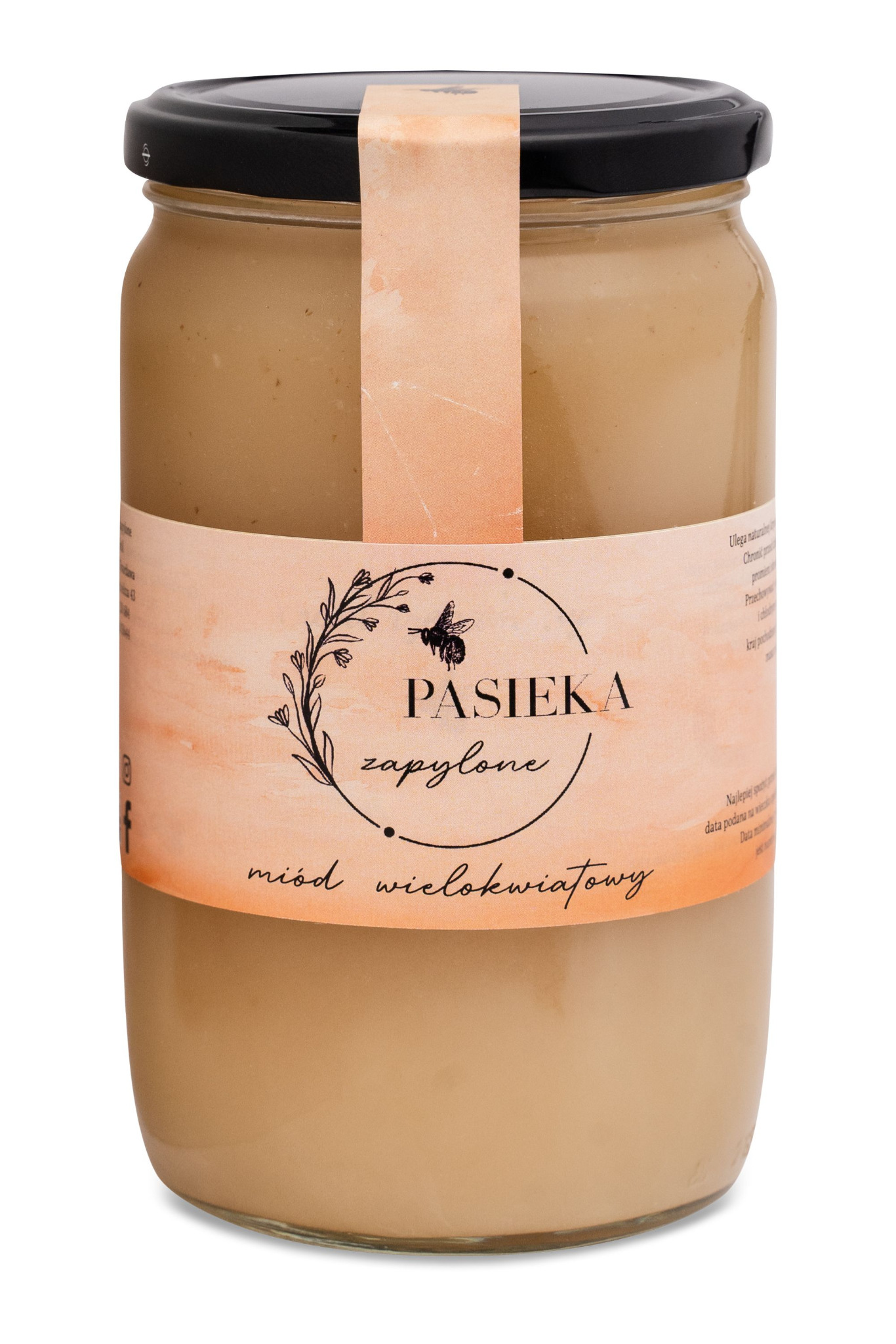 Słoik miodu wielokwiatowego z etykietą 'Pasieka Zapylone' na białym tle, zamknięty czarnym wieczkiem.
