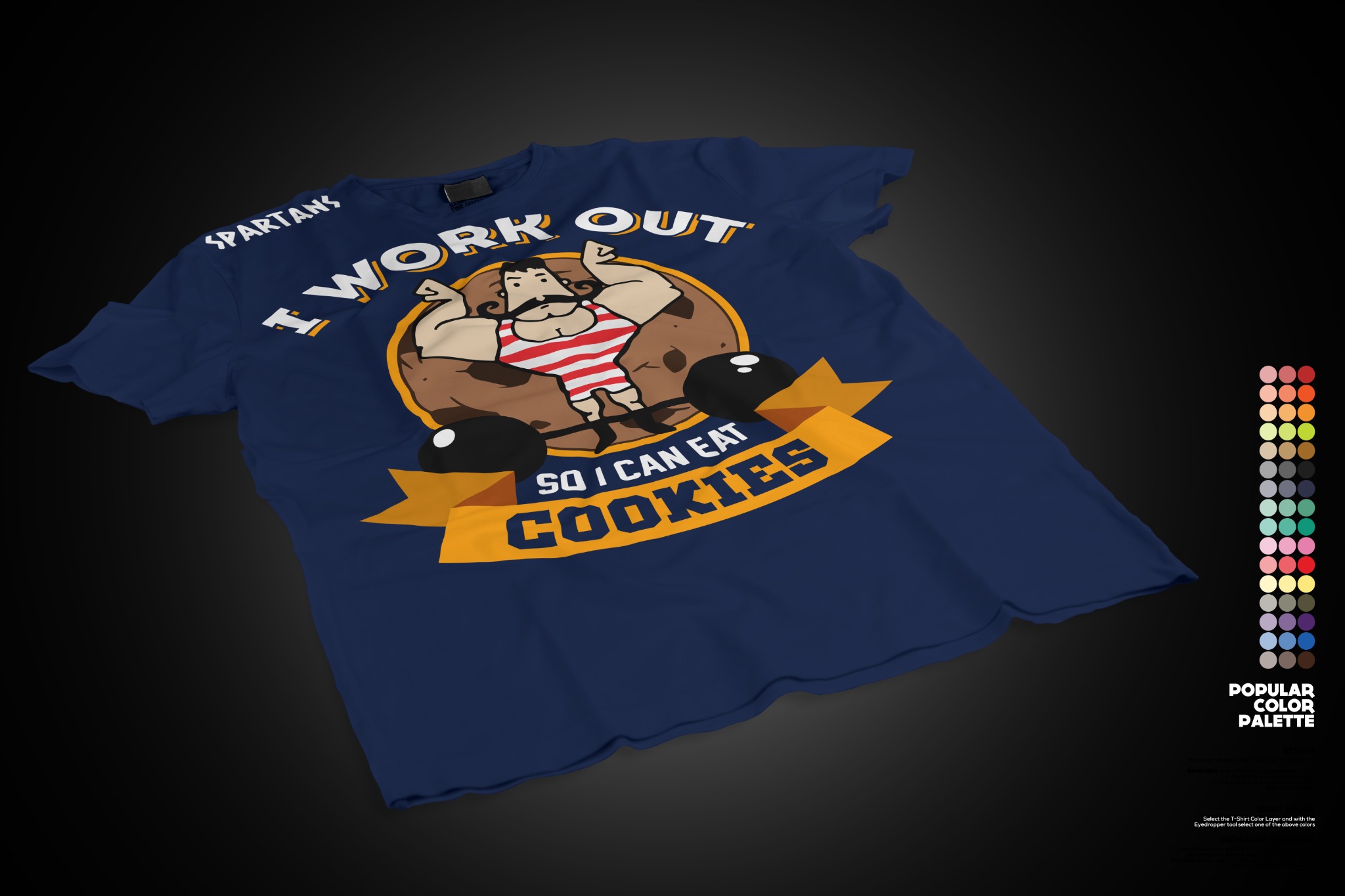Granatowa koszulka z nadrukiem kreskówkowym: muskularny mężczyzna z wąsami, otoczony hantlami i ciasteczkami, z napisem 'I work out so I can eat cookies' i słowem 'Spartans' u góry.