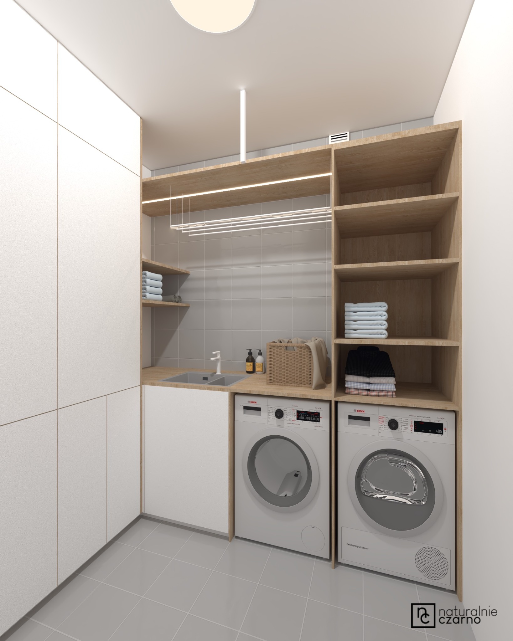Wizualizacja pomieszczenia pralni z pralką i suszarką Bosch, drewnianymi półkami z ręcznikami, szarym zlewem i białymi szafkami pod zabudowę.