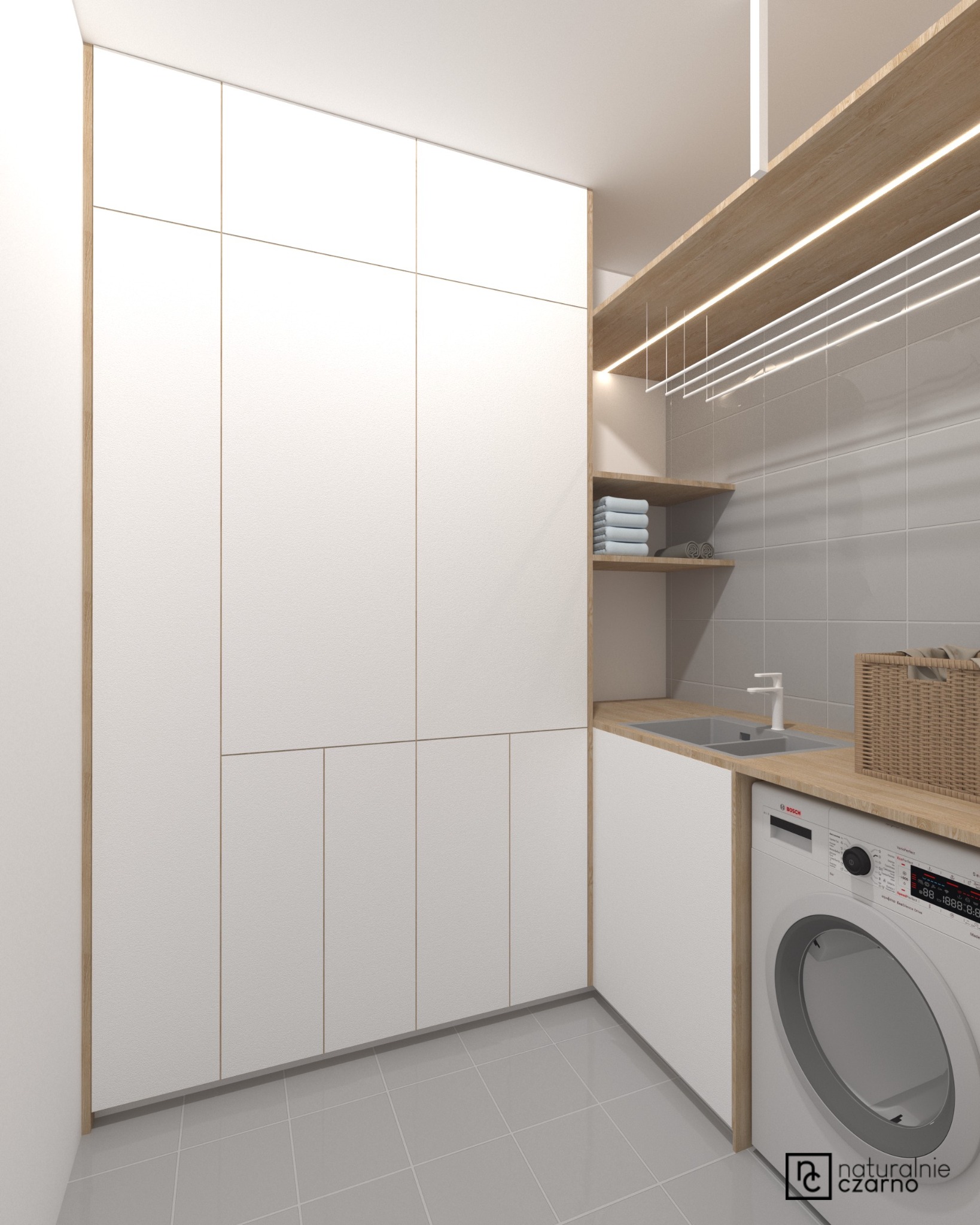 Wizualizacja nowoczesnej pralni: białe szafy z drewnianymi akcentami, pralka Bosch, umywalka, półki z ręcznikami i suszarka pod sufitem, szare płytki podłogowe i ścienne.