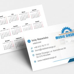Awante Kliczek Marta - Wizytówka firmy Meble Drzazga z kalendarzem 2022 w tle. Wizytówka zawiera logo firmy, imię i nazwisko właściciela oraz dane kontaktowe. Całość utrzymana w błękitnej kolorystyce.