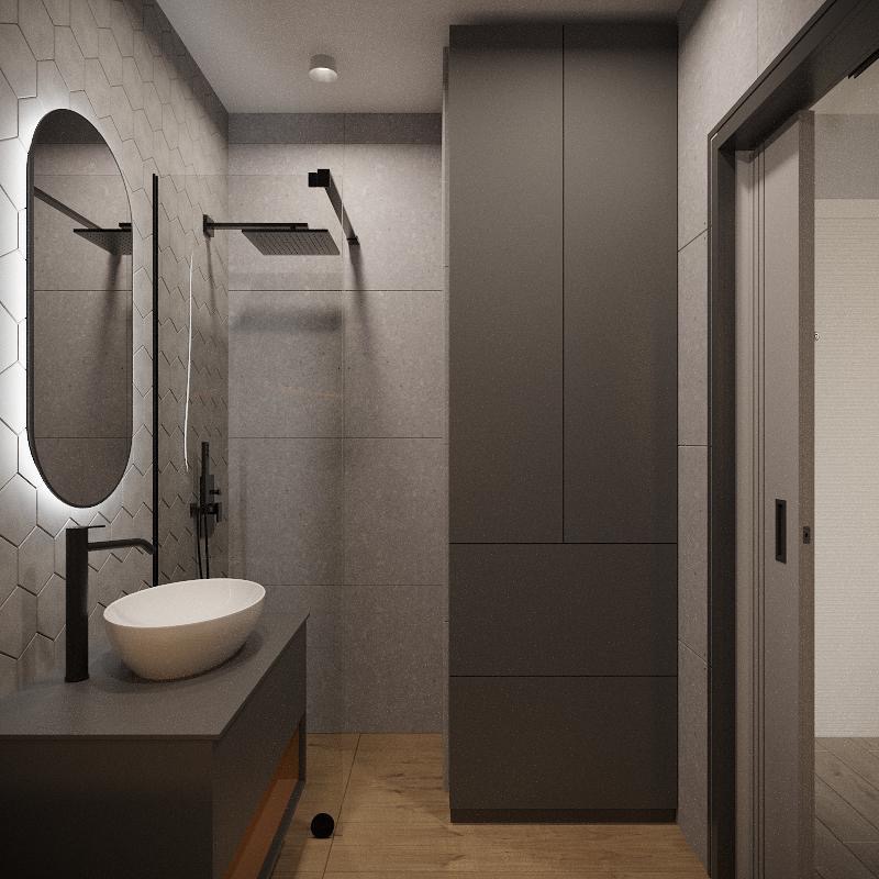 Nowoczesna łazienka w odcieniach szarości z owalnym lustrem podświetlanym LED, minimalistyczną umywalką nablatową i kabiną prysznicową typu walk-in z deszczownicą.