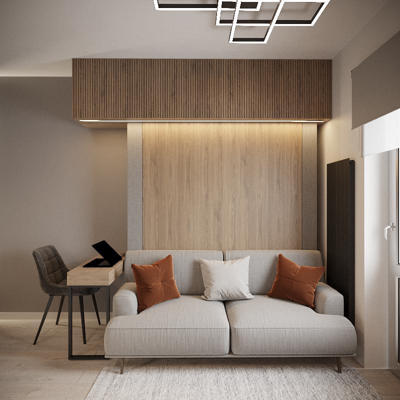 Nowoczesny salon z drewnianym panelem ściennym, szarą sofą z pomarańczowymi poduszkami, minimalistycznym biurkiem z laptopem i geometryczną lampą sufitową.