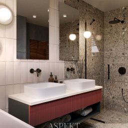 ASPEKT ARCHITEKTURA ANETTA SALA - Wizualizacja łazienki z dwoma umywalkami nablatowymi, szafką z czerwonymi lamelami i szarą obudową, oraz kabiną prysznicową wyłożoną płytkami imitującymi lastryko. Na ścianie białe płytki...