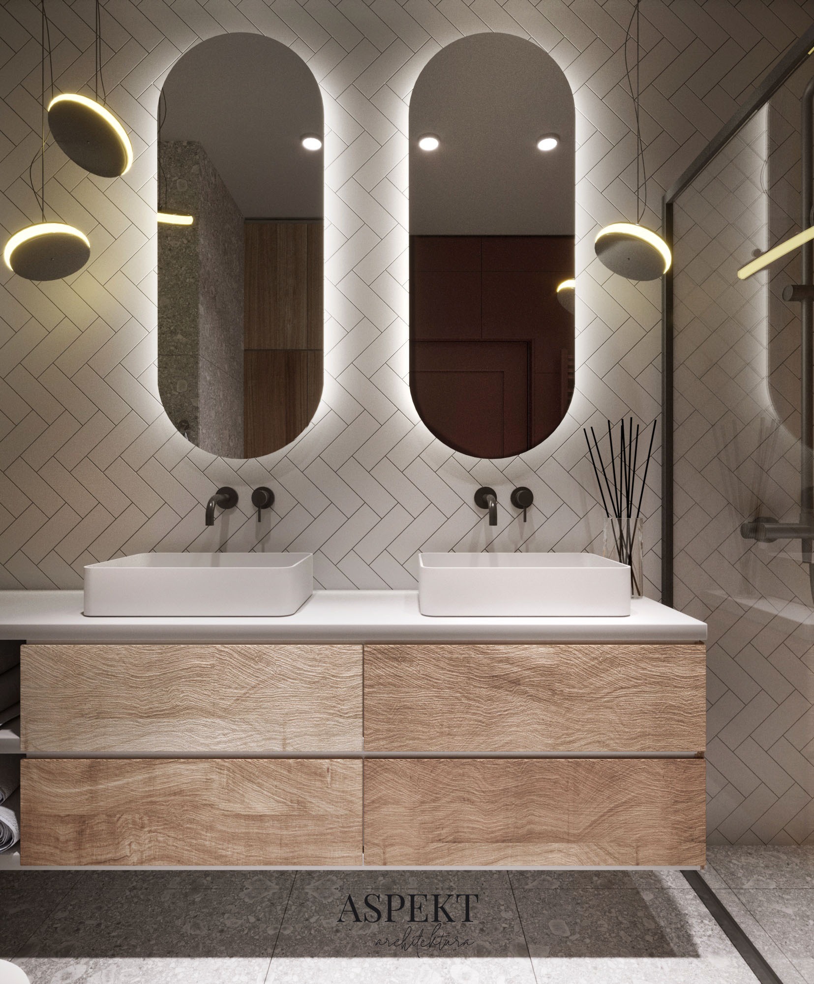 Nowoczesna łazienka z podwójną umywalką nablatową, drewnianą szafką z szufladami, podświetlanymi lustrami owalnymi i płytkami ułożonymi w jodełkę na ścianie, oświetlenie punktowe.